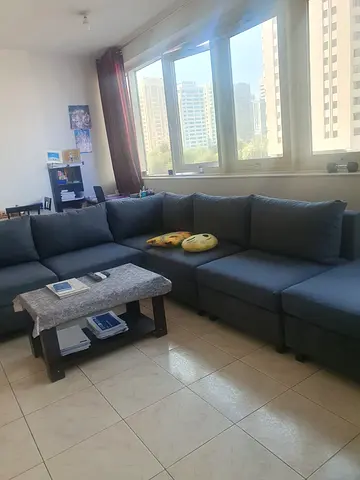 Large L-shaped Grey Fabric Sofa — Good Condition