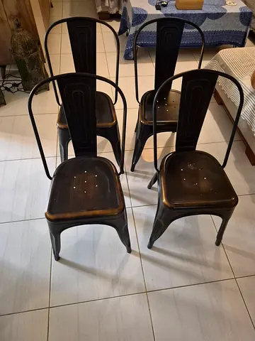 4 Tolix-style metal dining chairs - antique brass finish (used)
