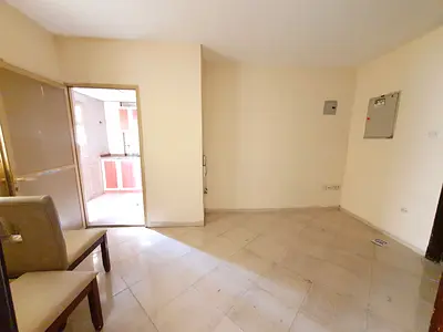 AMAZING 1BHK WITH BALCONY ON ROAD BUILDING IN MUWAILEH