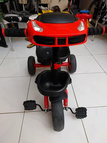 Red Kids Tricycle with Seat and Pedals - Good Condition light and music