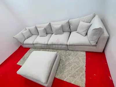 The One Brand light grey cloud modular sofa with ottoman