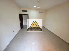 Dubai Exit A spacious 2-bedroom apartment with a living room is available for annual rent in Al Nuai