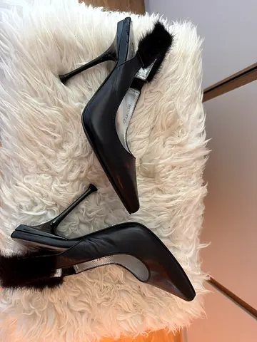 Black leather slingback heels with fur trim, size unknown