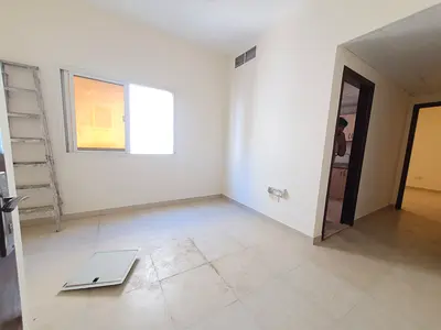 LAVISH 1BHK WITH CENTRAL AC ON ROAD BUILDING IN MUWAILEH