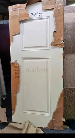 Solid white interior door with raised panels - good condition