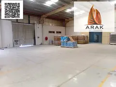 A large warehouse available for annual rent in Al Jurf Industrial 1, located on a main road, offerin