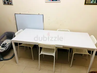 Ikea Expendable dining table with Chairs - 600 AED