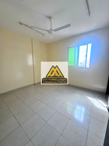Two-bedroom apartment with a separate living room for annual rent – ​​Two spacious bedrooms, two bathrooms, easy access to Dubai and Sharjah