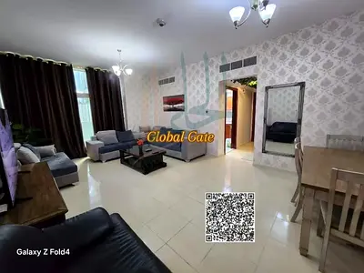 A fully furnished one-bedroom apartment with a living room is available for monthly rent, including all bills, in Orient Towers, Al Bustan area, Ajman