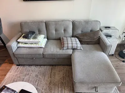 Light grey L-shaped chaise sofa bed — Pan Homes  (delivery included)