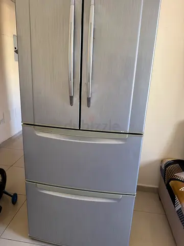 Silver double-door refrigerator with bottom freezer - good condition