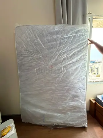 Queen-size mattress - lightly used, still in protective wrap