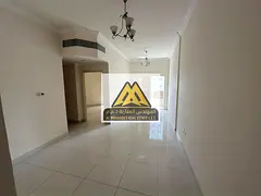 The apartment features two bedrooms, a large living room, two bathrooms, and a balcony that provides