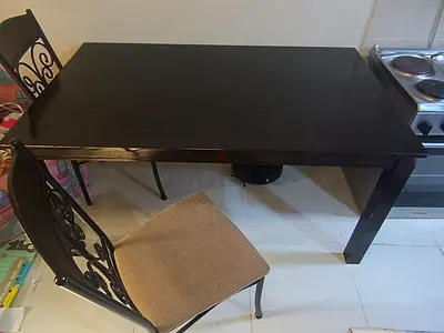 IKEA dark wood dining table with 4 decorative metal-back chairs - great condition