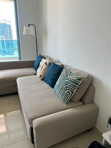 Light beige L-shaped sofa with chaise