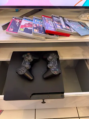 Sony PlayStation 3 Slim with 2 Controllers and Games - Good Condition