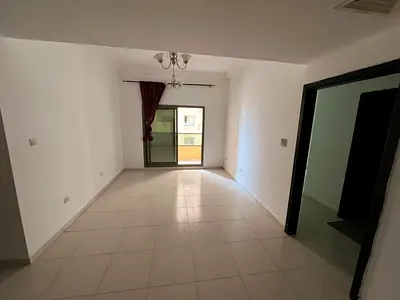 One bedroom and living room apartment in Ajman, UAE. Central air conditioning, free parking, and free maintenance.
