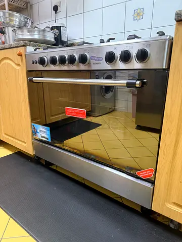 Used stainless steel gas cooker with oven - 5 burners