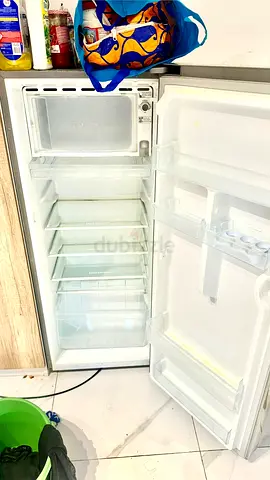 Tall single-door refrigerator in good working condition