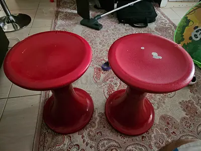 Pair of red plastic round stools (used) - sturdy lightweight