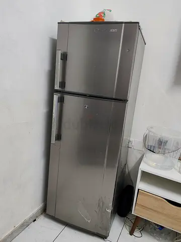 Used double-door stainless steel refrigerator - good condition