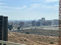 Two-bedroom apartment with a living room - Al Amrah, Ajman - Central air conditioning - Family accom