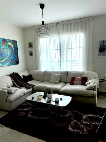 Light beige L-shaped fabric sofa — comfortable sectional in good condition