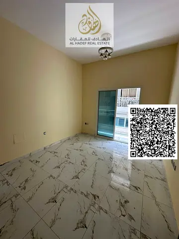 Apartment for rent in Al Jurf 2, one bedroom and living room, two bathrooms, balcony, master bedroom, private parking, second tenant. Price 32,000 AED