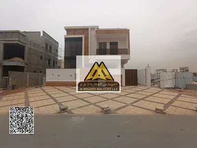 Villa for sale in Al Helio 2, Ajman, in a prime location with a spacious design suitable for large families, featuring high-quality finishes and pract