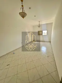 Two-bedroom apartment with a spacious living room in New Muwaileh, modern building, close to all ser