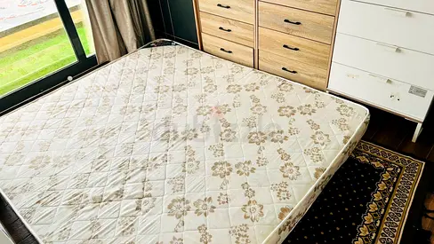 Queen mattress in good used condition with patterned cover