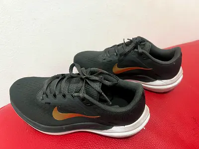 Used Nike black running shoes - size unknown, good condition
