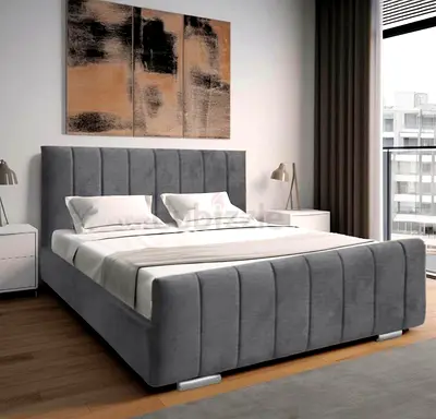 Grey upholstered double bed with headboard and storage base