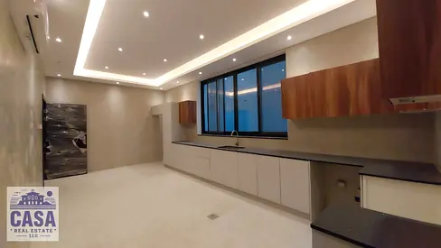 Villa for sale in Ajman, Al Zahia area, 7 bedrooms, 6 bathrooms, and 2 living rooms with a modern design.