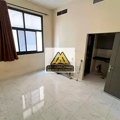 Studio for rent in Al Jurf 3, Ajman, second tenant, semi-separate kitchen, new building, central AC,