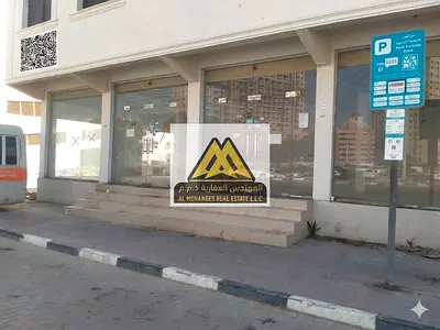 Two large shops | Can be combined to open any business | Shop 1: AED 60,000 annually | Shop 2 (corner): AED 70,000 | Both shops together: AED 120,000