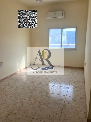 Two bedrooms and hall in Al Rawda 3 for annual rent for employees at a good price close to all services at an excellent price with payment facilities