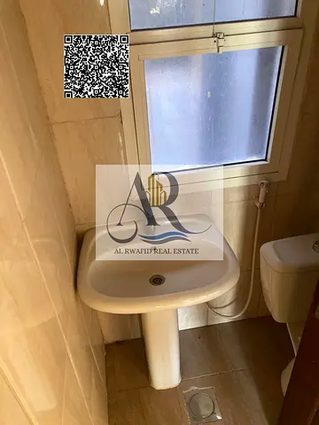 Two bedrooms and hall in Al Rawda 3 for annual rent for employees at a good price close to all services at an excellent price with payment facilities
