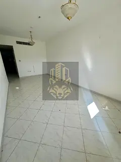 Two-bedroom apartment with a spacious living room in New Muwaileh, modern building, close to all ser