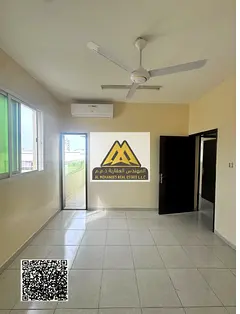 Two-bedroom apartment with a living room in Al Rawda 1, Ajman, separated by a door, 2 bathrooms, bal