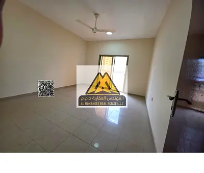 Two-bedroom apartment with a living room in Al Nuaimiya, Ajman. 2 bathrooms, 2 balconies, parking, prime location next to Zone Fashion, AED 36,000 per