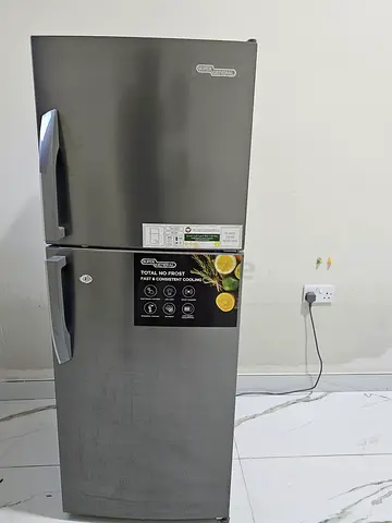 Grey top-freezer refrigerator in good working condition