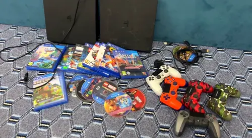 Two PS4 consoles with 8+ games and 6 controllers - bundle