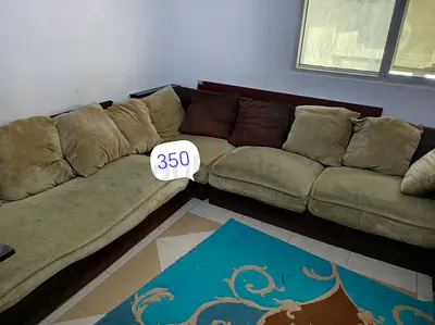 Large L-shaped fabric sofa — comfortable used corner couch