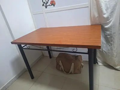 Simple wooden dining/work table with metal legs - good condition
