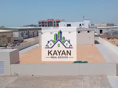 Industrial yard for rent with a total area of 36,000 sq. ft. direct from owner , featuring two warehouses 7,000 sq. ft