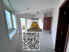 Studio apartment for annual rent in Al Rashidiya 3, Ajman, behind Grand Mall, with a semi-separate k