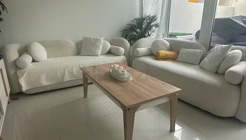 Pair of Cream Curved Fabric Sofas - 3 Seaters size 120 x 85cm