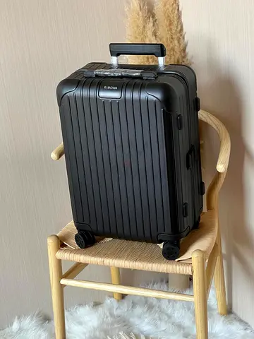 black RIMOWA Essential Cabin hardshell suitcase