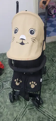 Lightweight beige baby stroller in good condition